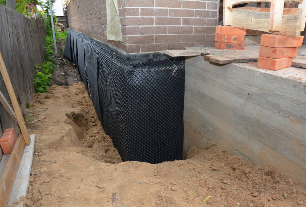 Happy homeowners after waterproofing job in Nickerson